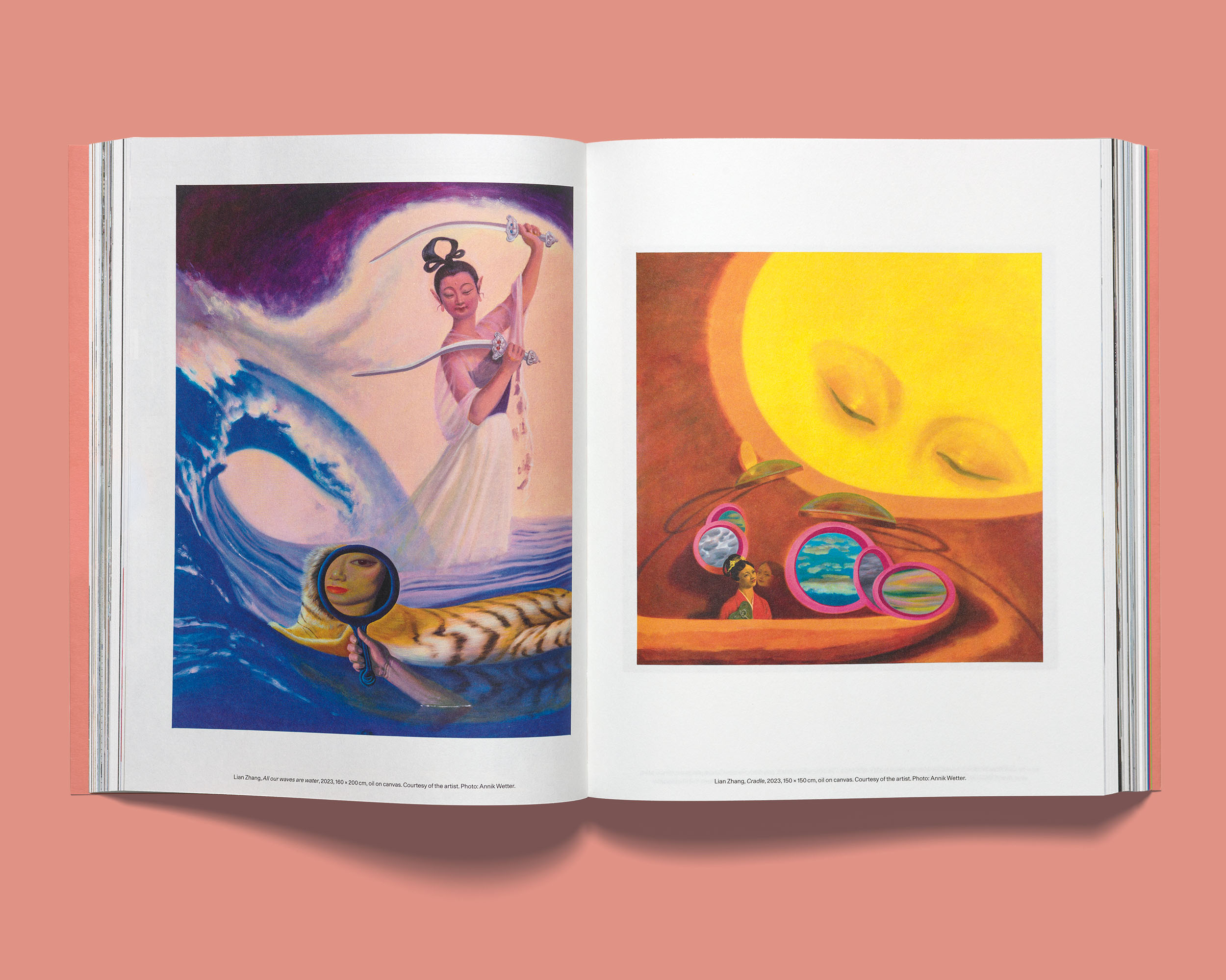 Open Acne Paper displaying two oil paintings by Lian Zhang on white pages, placed against a coral pink background.